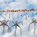 colorful mexican pinatas decoration with clouds