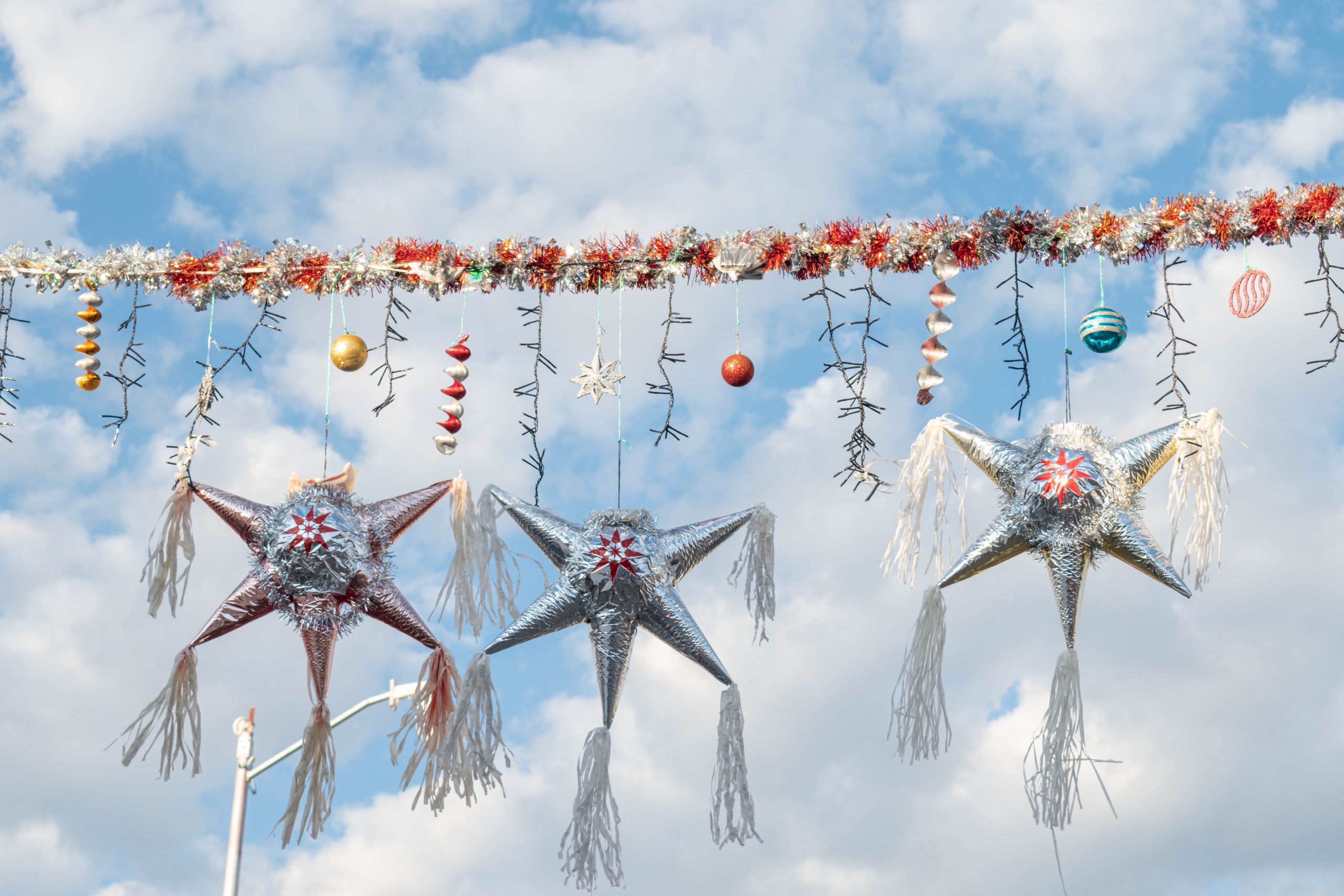 colorful mexican pinatas decoration with clouds