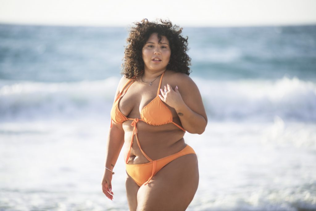 curvy girl in swimsuit on beach mexico