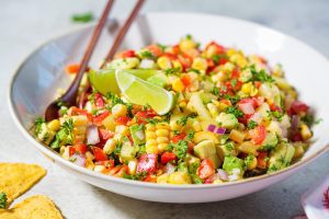 Mexican quinia corn salad on white plate. 