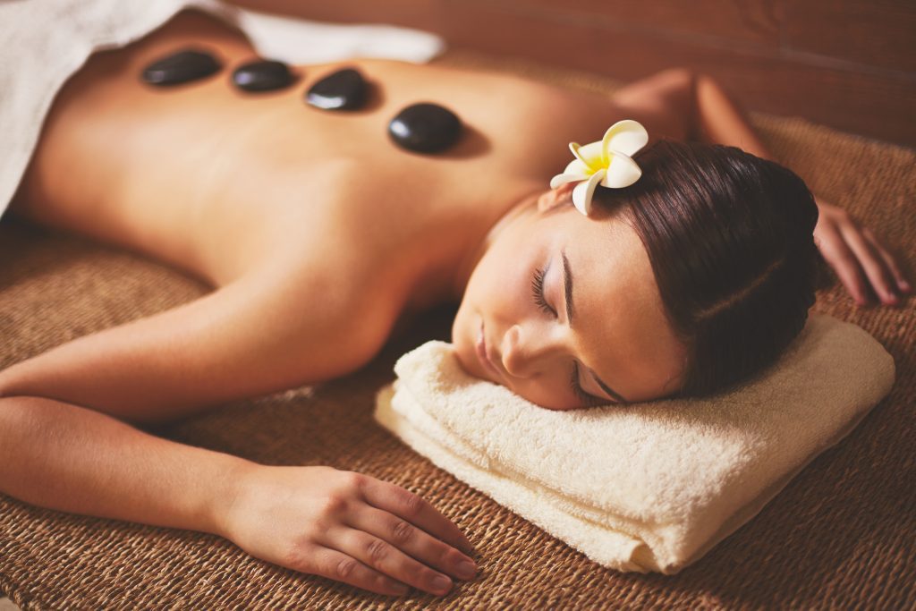 female lying in wellness spa mexico during beauty procedure