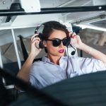 woman pilot in headset ready to fly in mexico airplane