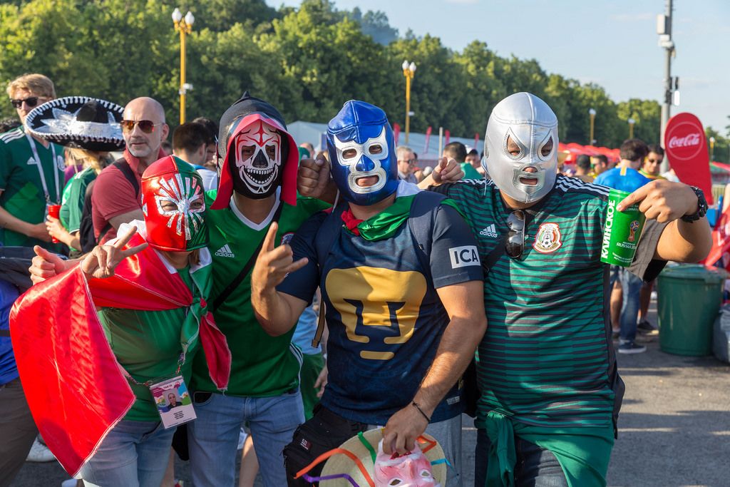 Mexican soccer fans wearing masks to watch mexico soccer on live streaming