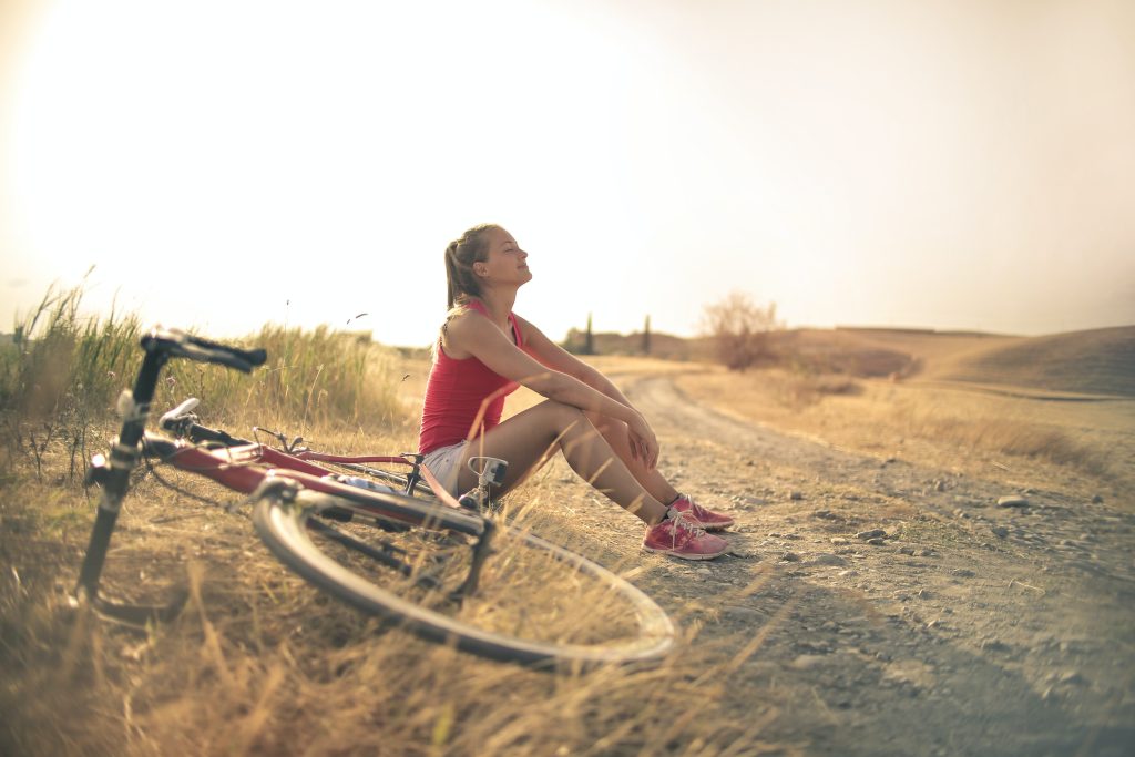 girl biking an examples of wellness tourism