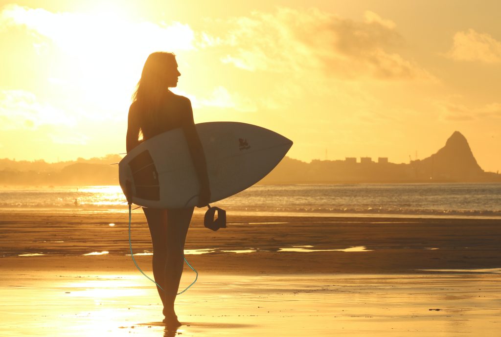 lady-with-surf-board-sunset