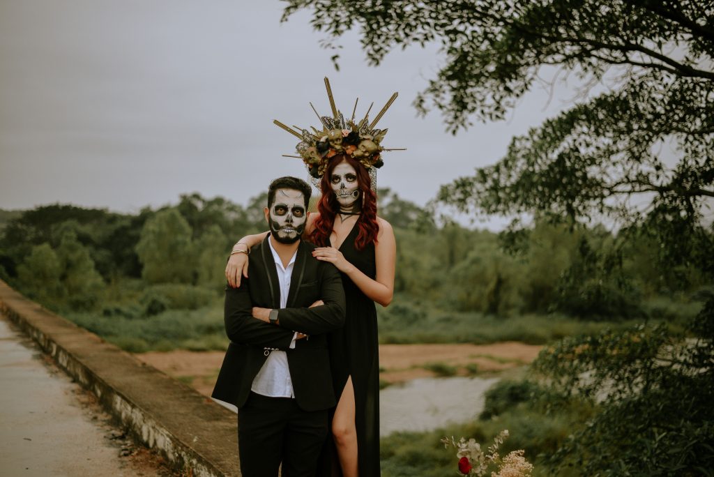 mexican couple with skeleton makeup