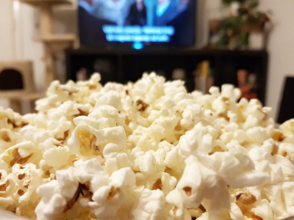 popcorn in front tv watching mexican movie netflix